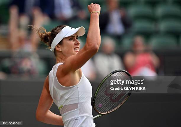 Ukraine's Elina Svitolina reacts as she plays Belarus' Victoria Azarenka during their women's singles tennis match on the seventh day of the 2023...