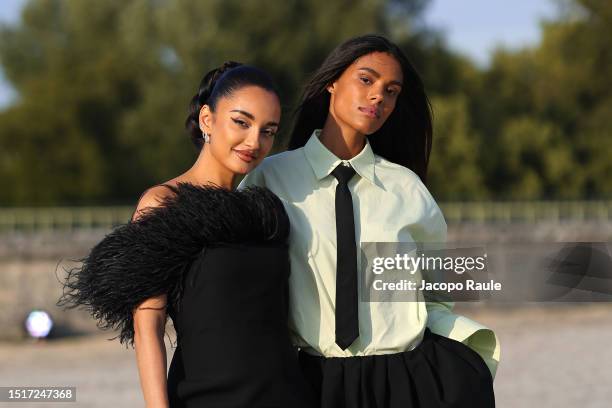 Amina Muaddi and Tina Kunakey attend the Valentino Haute Couture Fall/Winter 2023/2024 show as part of Paris Fashion Week at Chateau de Chantilly on...