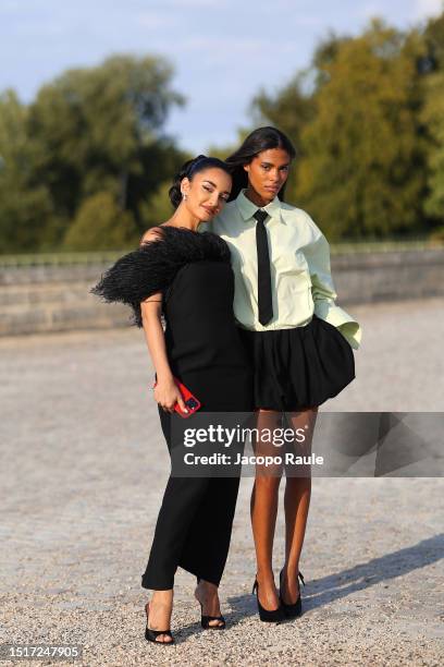 Amina Muaddi and Tina Kunakey attend the Valentino Haute Couture Fall/Winter 2023/2024 show as part of Paris Fashion Week at Chateau de Chantilly on...