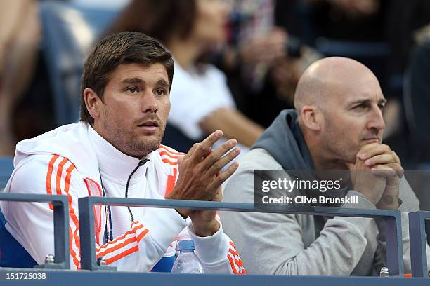 Daniel Vallverdu and Jez Green watch Andy Murray of Great Britain during his men's singles final match against Novak Djokovic of Serbia on Day...