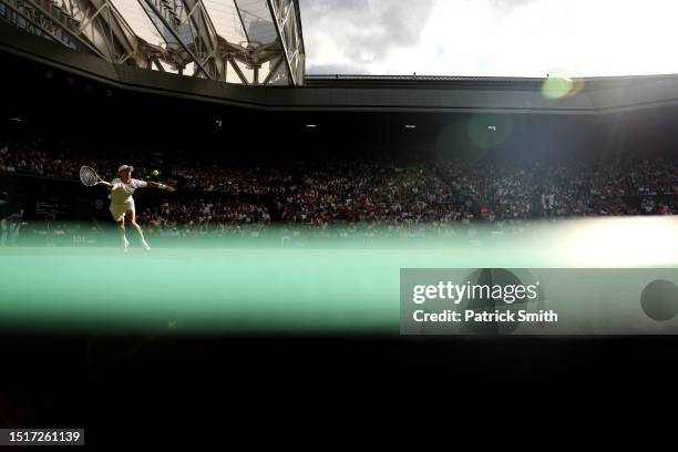 Jordan Thompson of Australia plays a forehand against Novak Djokovic of Serbia in the Men's Singles second round match during day three of The...