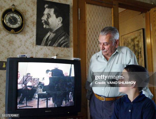 Concert pianist Josef Vissarionovitch Dzhugashvili , the great-grandson of former Soviet dictator Stalin, watches with his grandfather Yevgeny...