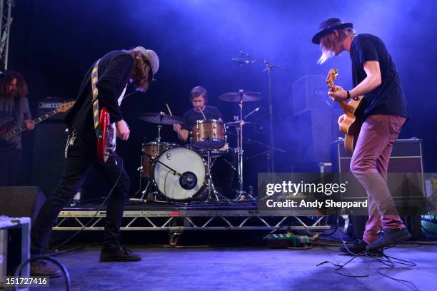 Aaron Lee Tasjan, Fredrik Aspelin and Petter Ericson Stakee of the band Alberta Cross performs on stage during Reading Festival 2012 at Richfield...