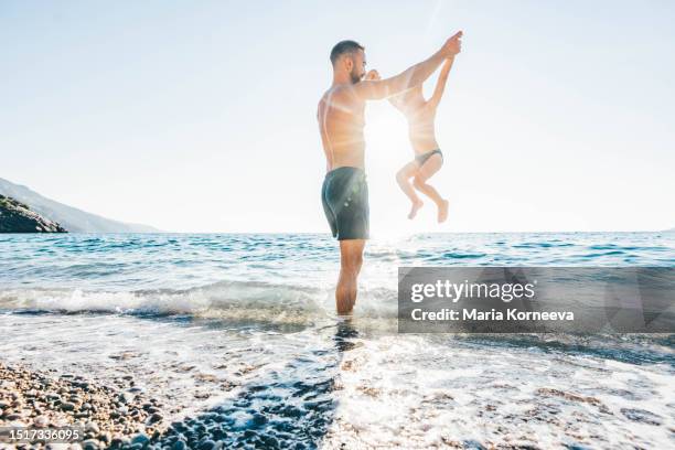 father and son enjoying sea. - turkish boy stockfoto's en -beelden