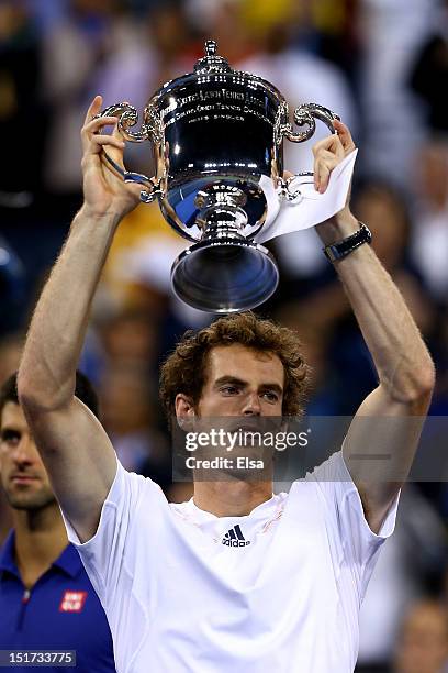 Andy Murray of Great Britain lifts the US Open championship trophy after defeating Novak Djokovic of Serbia in the men's singles final match on Day...