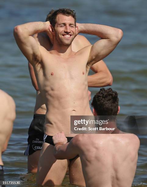 Travis Cloke of the Magpies looks on during a Collingwood Magpies AFL recovery session at the St Kilda Sea Baths on September 11, 2012 in Melbourne,...