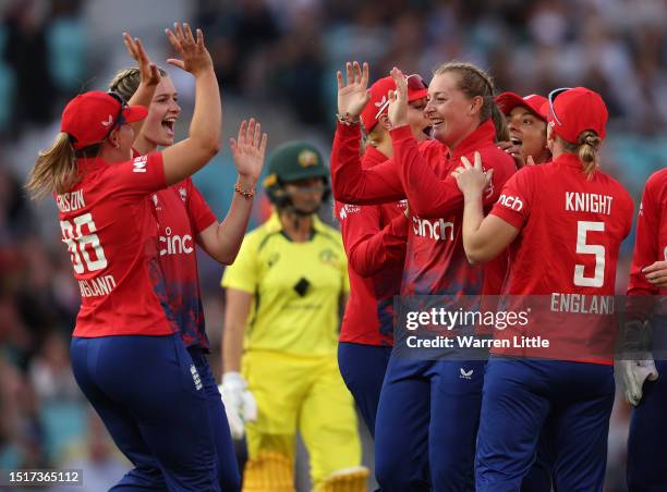 Sophie Ecclestone of England is congratulated as Ashleigh Gardener of Australia is run out during the Women's Ashes 2nd Vitality IT20 match between...