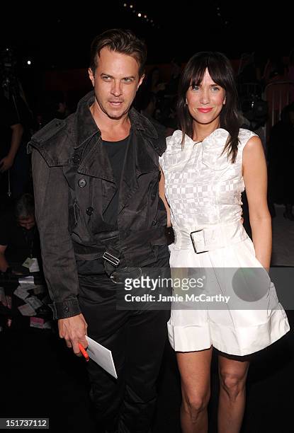 Casey Spooner and Kristen Wiig attend the Marc Jacobs Spring 2013 fashion show during Mercedes-Benz Fashion Week at N.Y. State Armory on September...
