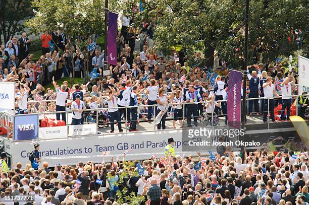 Members of the public turn out in force to show support for the British athletes during the parade of Team GB's Olympic and Paralympic athletes on...