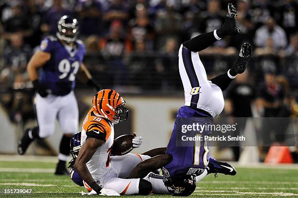 Safety Bernard Pollard of the Baltimore Ravens flips over wide receiver A.J. Green of the Cincinnati Bengals as he makes a tackle in the second...