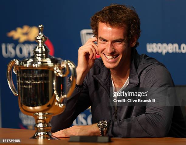 Andy Murray of Great Britain speaks to members of the media next to the US Open championship trophy during a press conference after defeating Novak...