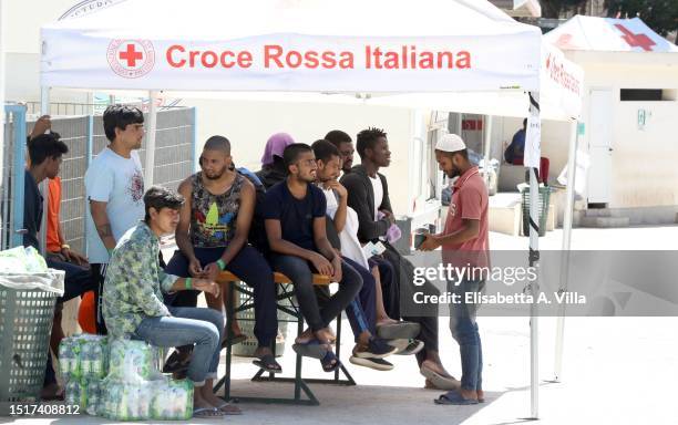 Migrants are seen at the Lampedusa Hotspot on July 04, 2023 in Lampedusa, Italy. The Contrada Imbriacola hotspot of Lampedusa, now managed by Croce...