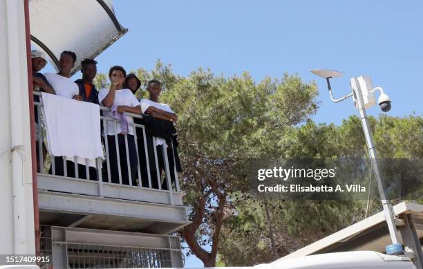 Migrants are seen at the Lampedusa Hotspot on July 04, 2023 in Lampedusa, Italy. The Contrada Imbriacola hotspot of Lampedusa, now managed by Croce...