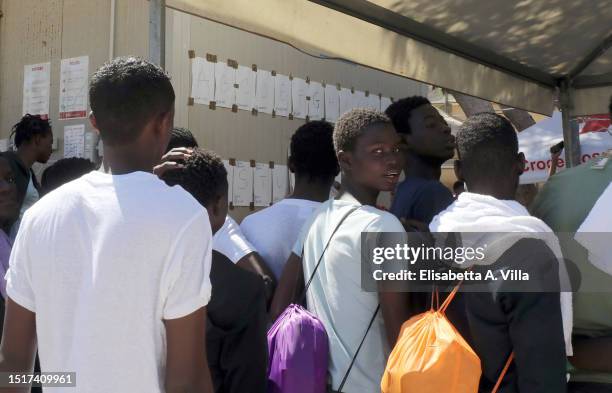 Migrants are seen at the Lampedusa Hotspot on July 04, 2023 in Lampedusa, Italy. The Contrada Imbriacola hotspot of Lampedusa, now managed by Croce...