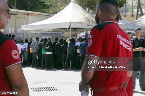 Migrants are seen at the Lampedusa Hotspot on July 04, 2023 in Lampedusa, Italy. The Contrada Imbriacola hotspot of Lampedusa, now managed by Croce...