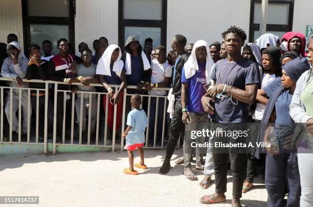 Migrants are seen at the Lampedusa Hotspot on July 04, 2023 in Lampedusa, Italy. The Contrada Imbriacola hotspot of Lampedusa, now managed by Croce...