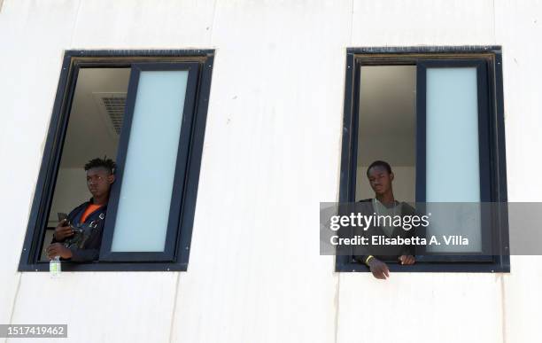 Migrants are seen at the Lampedusa Hotspot on July 04, 2023 in Lampedusa, Italy. The Contrada Imbriacola hotspot of Lampedusa, now managed by Croce...