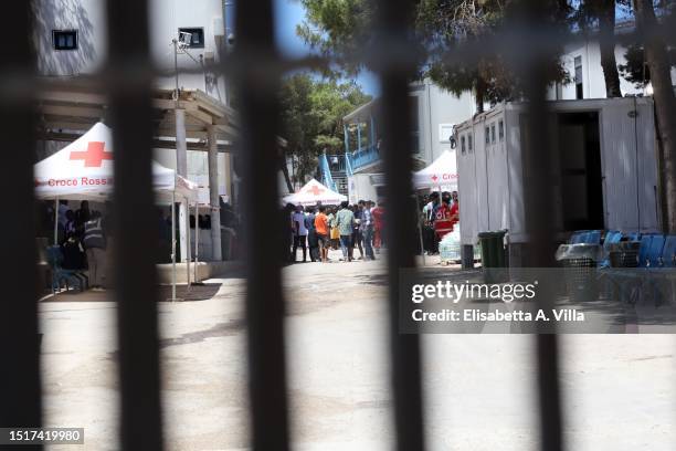 The Lampedusa Hotspot is seen through the entrance gate on July 04, 2023 in Lampedusa, Italy. The Contrada Imbriacola hotspot of Lampedusa, now...