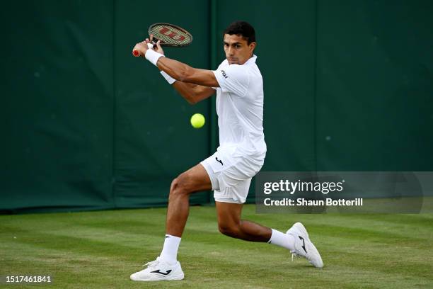 Thiago Monteiro of Brazil plays a backhand against Christopher Eubanks of United States in the Men's Singles first round match during day three of...