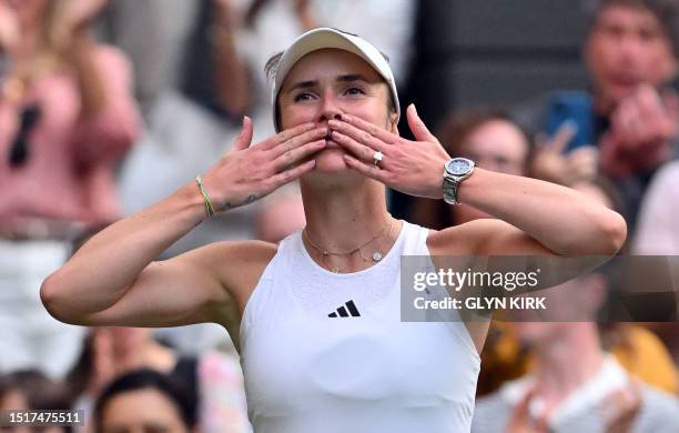 Ukraine's Elina Svitolina celebrates beating Belarus' Victoria Azarenka during their women's singles tennis match on the seventh day of the 2023...