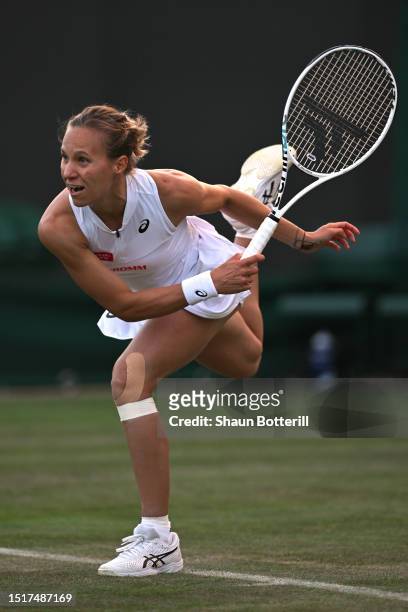 Viktorija Golubic of Switzerland serves against Anna Karolina Schmiedlova of Slovakia in the Women's Singles first round match during day three of...
