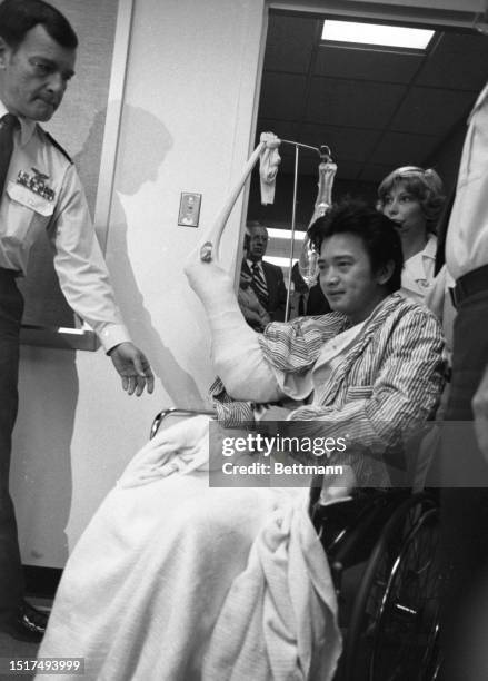 Steve Sung, one of the six wounded victims of the jungle ambush in South American, is flown to Washington, DC for treatment. The NBC sound technician...