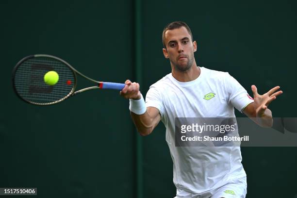 Laslo Djere of Serbia plays a forehand against Maxime Cressy of United States in the Men's Singles first round match during day three of The...