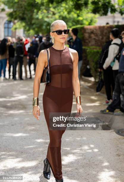 Caroline Caro Daur is seen wearing brown transparent dress outside Elie Saab during the Haute Couture Fall/Winter 2023/2024 as part of Paris Fashion...