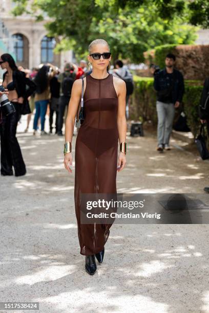 Caroline Caro Daur is seen wearing brown transparent dress outside Elie Saab during the Haute Couture Fall/Winter 2023/2024 as part of Paris Fashion...