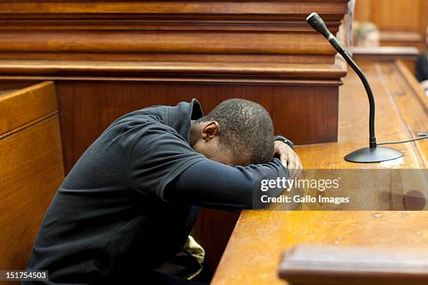 Xolile Mngeni appears at the Cape Town High Court, on September 3, 2012 in Cape Town, South Africa. He is accused of being involved in the murder of...
