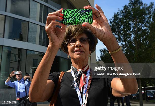 Alnita Dunn of Los Angeles, CA photographs the marquis on the convention center on Sept 3 as the city of Charlotte, NC prepares for the 2012...