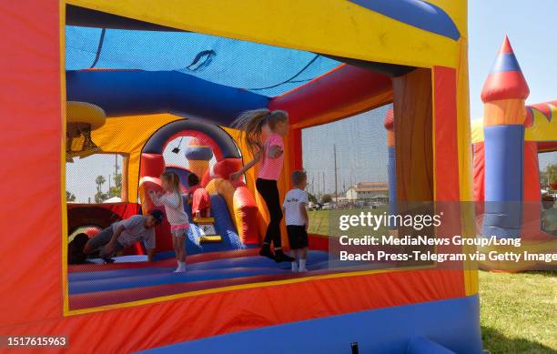 San Pedro , CA Children play in a bounce house during the Bloody Thursday picnic at 22nd Street Park in San Pedro on Wednesday, July 5, 2023. It is...