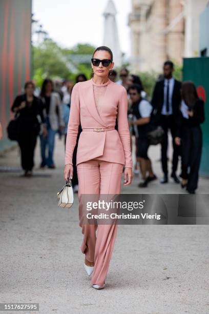 Nieves Alvarez is seen wearing rose belted blazer, pants, bag outside Elie Saab during the Haute Couture Fall/Winter 2023/2024 as part of Paris...
