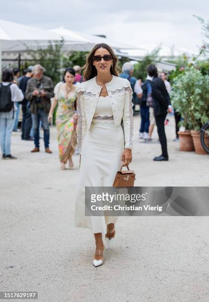Tamara Kalinic is seen wearing white laced jacket, dress outside Elie Saab during the Haute Couture Fall/Winter 2023/2024 as part of Paris Fashion...