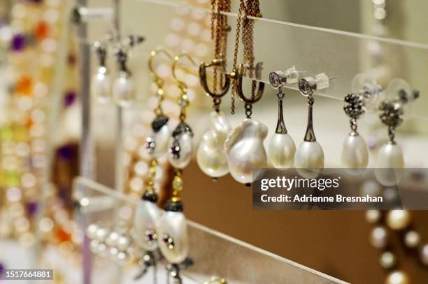 close up of pearl earrings display at beijing’s hong qiao pearl market - fashion glamour pearl stock pictures, royalty-free photos & images