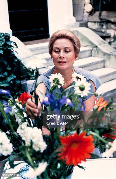 Princess Grace of Monaco poses in her garden at home in June 1981 in Paris. Grace Kelly, American born, who married Prince Rainier III of Monaco in...