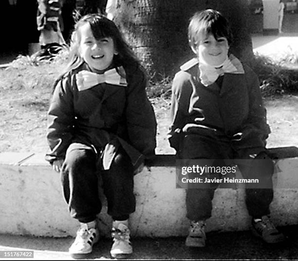 In this reproduction Lionel Messi of elementary school General Las Heras pose for a picture on 1992, in Rosario, Argentina. Barcelona´s Lionel Messi...