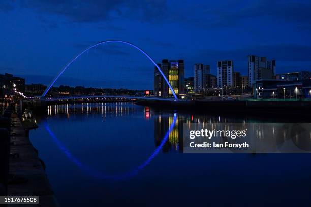 The Gateshead Millennium Bridge is bathed in blue light to mark the 75th anniversary of the National Health Service on July 05, 2023 in Newcastle...