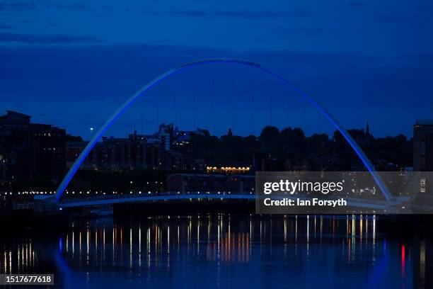 The Gateshead Millennium Bridge is bathed in blue light to mark the 75th anniversary of the National Health Service on July 05, 2023 in Newcastle...