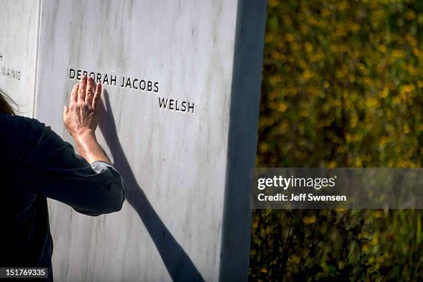 Cynthia Salter, who lost her sister, Catherine, in the South Tower on 9/11 pauses in front of the Wall of Names at the Flight 93 National Memorial...