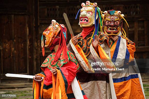 three demons mask dance - bhutan monk stock pictures, royalty-free photos & images