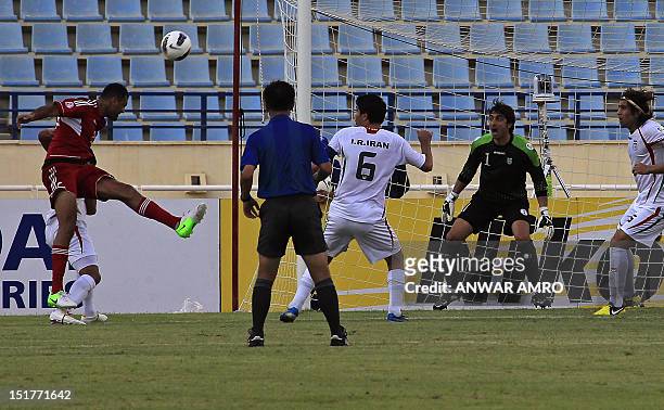 Lebanon's midfielder Roda Antar heads the ball to score a goal against Iran during their 2014 World Cup Asian zone group A qualifying football match...
