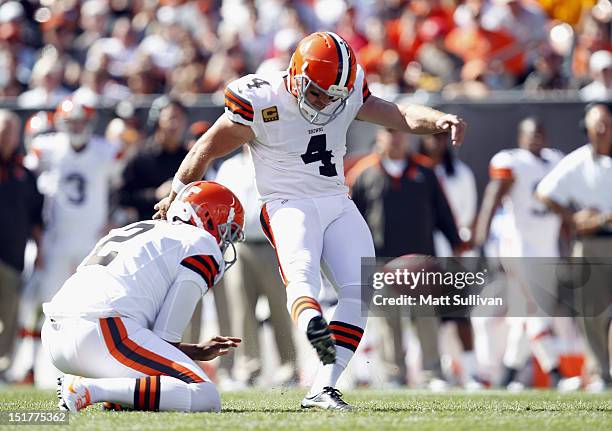 Kicker Phil Dawson of the Cleveland Browns kicks a field goal as Reggie Hodges holds against the Philadelphia Eagles their season opener at Cleveland...