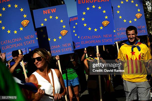 People hold banners that it reads 'Catalonia: New European State' in a demonstration calling for independence during the Catalonia's National Day on...
