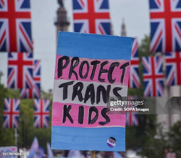 Protect Trans kids' placard seen during the demonstration in Piccadilly Circus. Thousands of people marched through central London during Trans Pride...