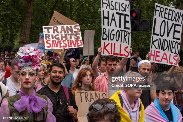 Activists and protesters hold placards expressing their opinion during the demonstration. Thousands of people participated in the Trans Pride 2023...
