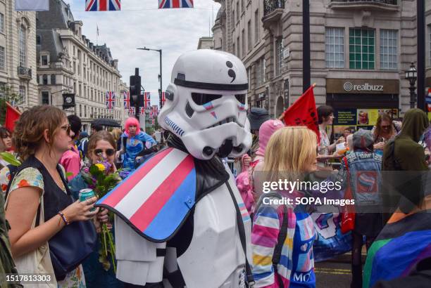 Protester wears a Star Wars Stormtrooper costume with trans pride colors during the demonstration in Piccadilly Circus. Thousands of people marched...
