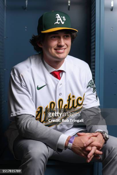 Jacob Wilson poses for a photo after being drafted to the Oakland Athletics as the sixth pick in the MLB Draft presented by Nike at Lumen Field on...