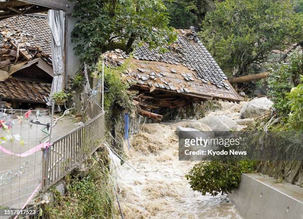 Photo taken on July 10 shows a house hit by a mudslide in Karatsu in Saga Prefecture, southwestern Japan, following heavy rain.