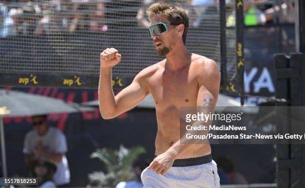Hermosa Beach, CA Taylor Crabb reacts after scoring against Theo Brunner and Trevor Crabb in the first set of a men's beach volleyball championship...